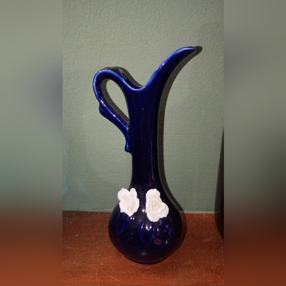 Elegant Blue Vase with White Floral Accents